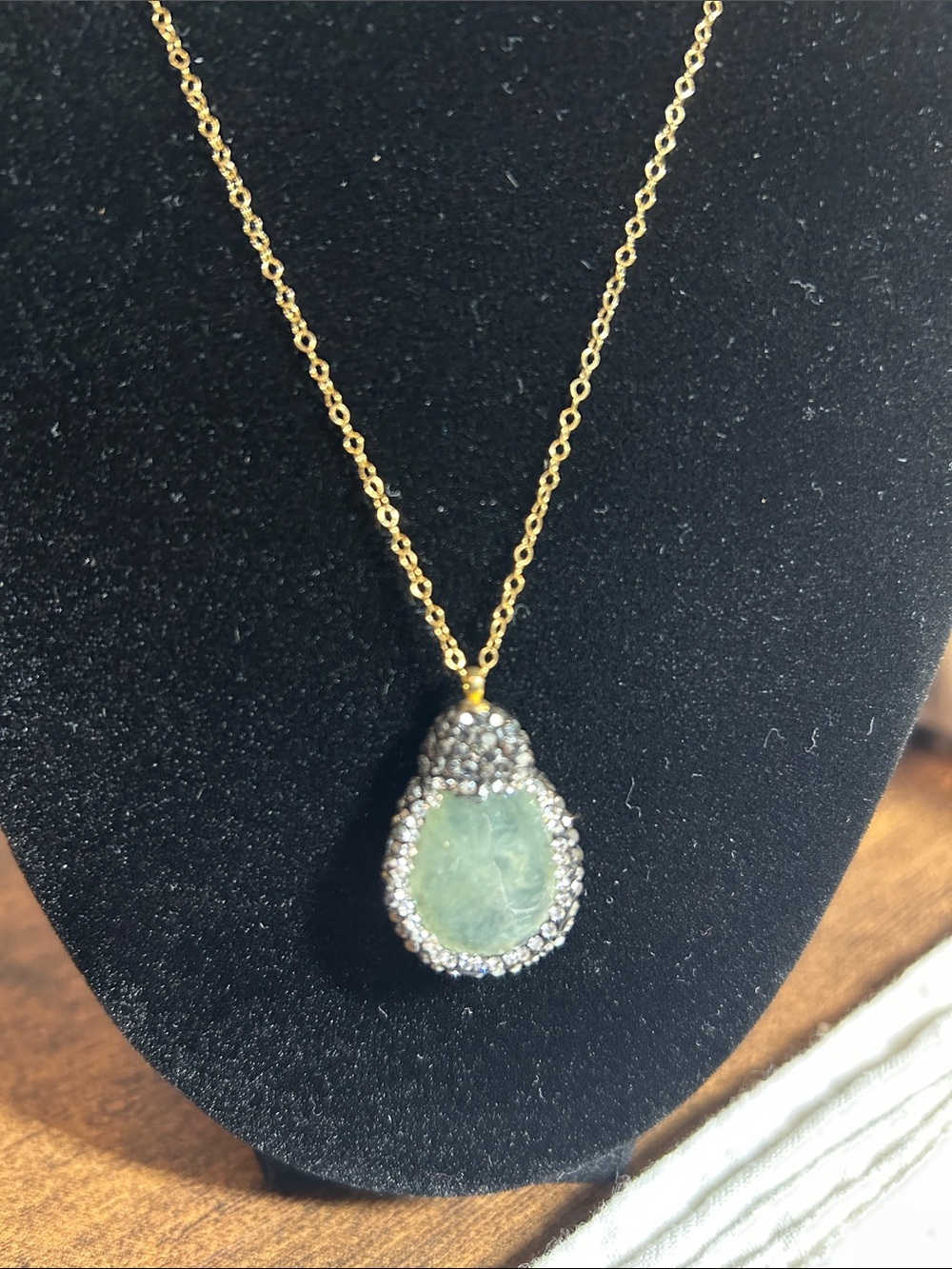 Gold-Tone Necklace with Pale Green Jade Pendant and Crystal Halo